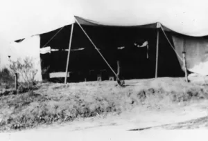 View of the temporary location of St. Dominic Catholic Church, when it was housed in a tent. In the spring of 1921, two lots were purchased on Merton Ave. in Eagle Rock, and the tents were erected. On October 16, 1921, Fr. Francis Driscoll, O.P., St. Dominic's first Pastor, offered the first mass in this place of worship.