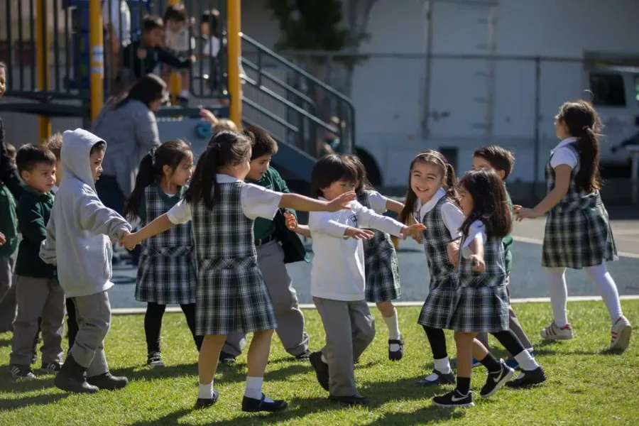 St. Dominic students playing together on the field